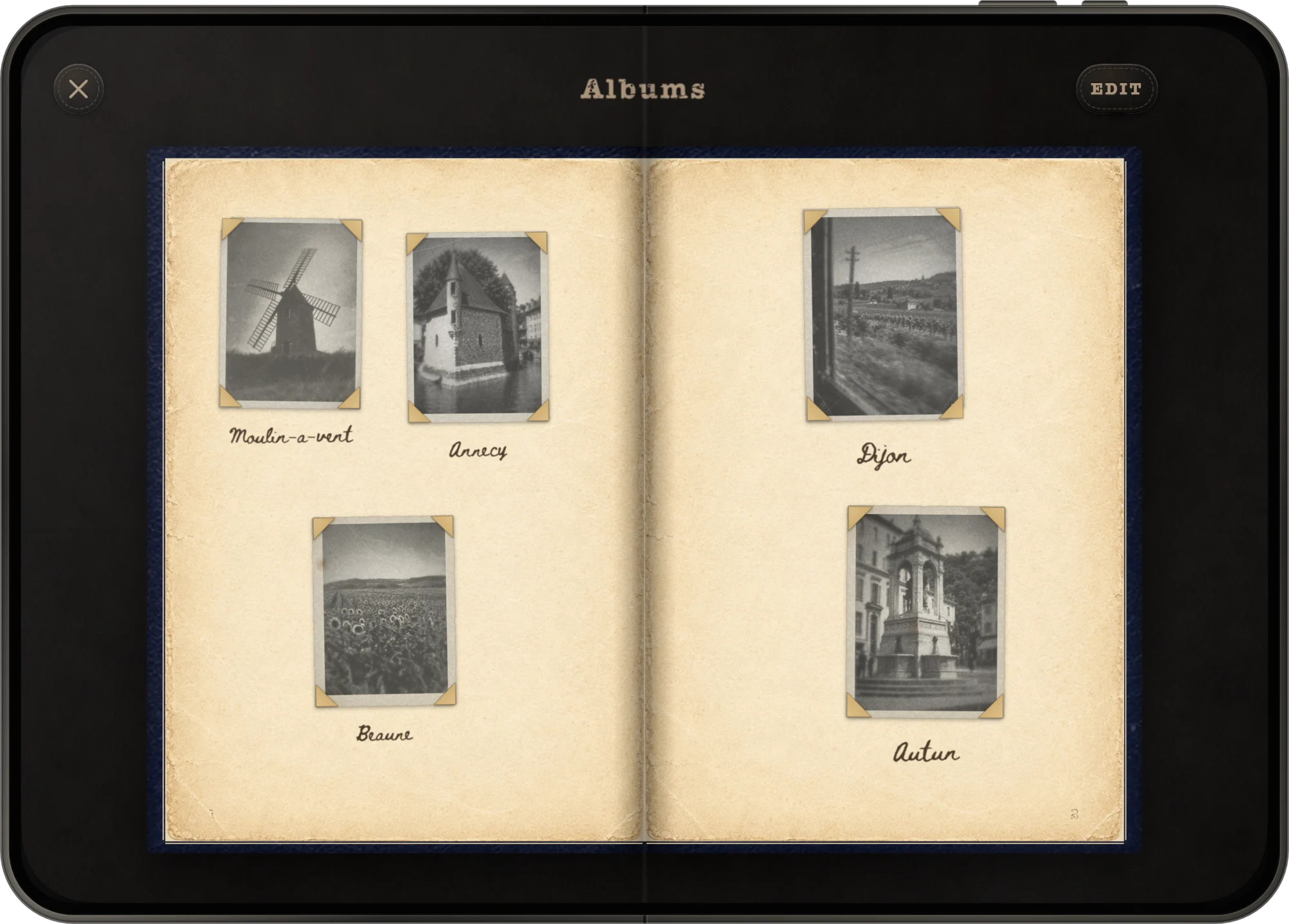 A leather album open as a two-page spread on iPhone Duo.